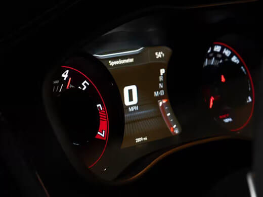 A close-up of the Driver Information Digital Cluster displaying zero mph in a 2023 Dodge Challenger.